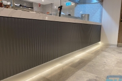 Fluted-mdf-wall-paneling-amex-lounge