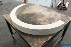 Compressed fibre cement, CNC machined into curves to be used as window frames