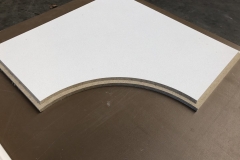 Corner tiles with a tegular edge