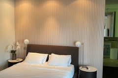 Textured MDF panelling bedhead