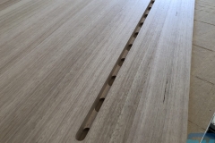 Solid timber desktop with integrated device slot